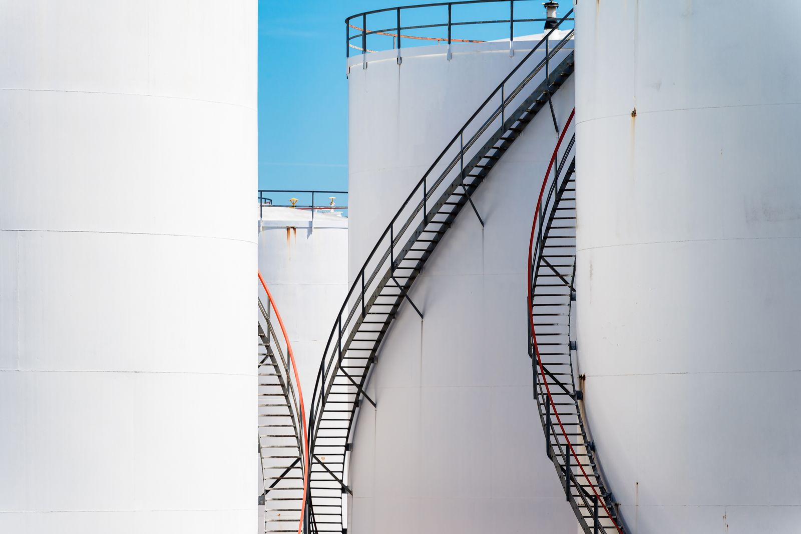 View of a massive underground oil storage complex, with pipes and concrete structures.